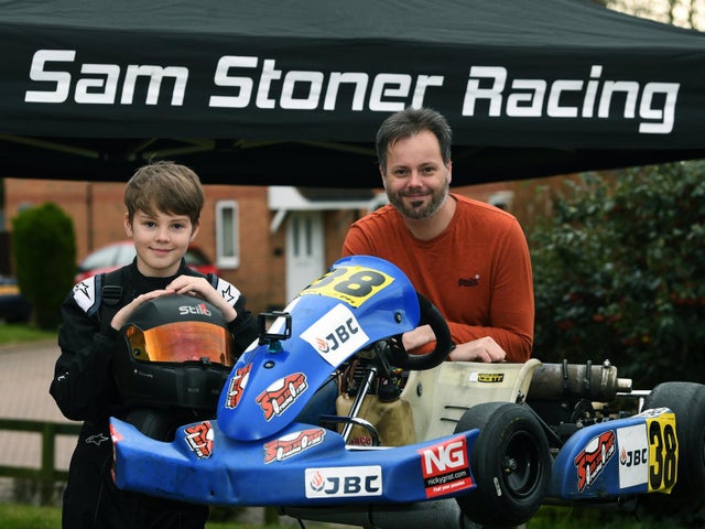 Sam Stoner Racing | Yorkshire Evening Post | Article | Sam and his Dad next to kart, infront of the SSR awning.