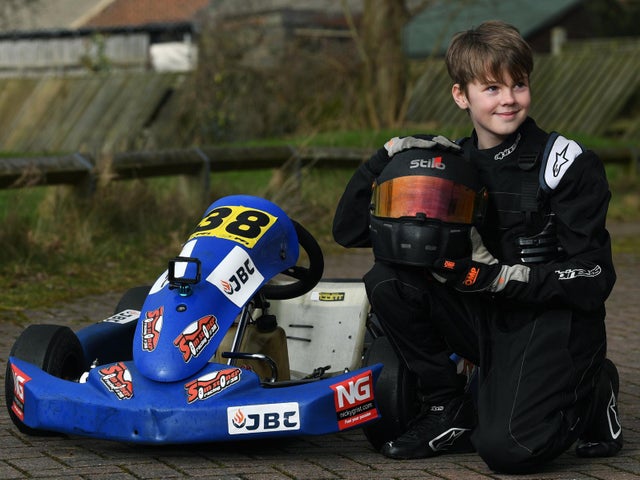 Sam Stoner Racing | Yorkshire Evening Post | Article | Sam sat next to the kart, looking left.